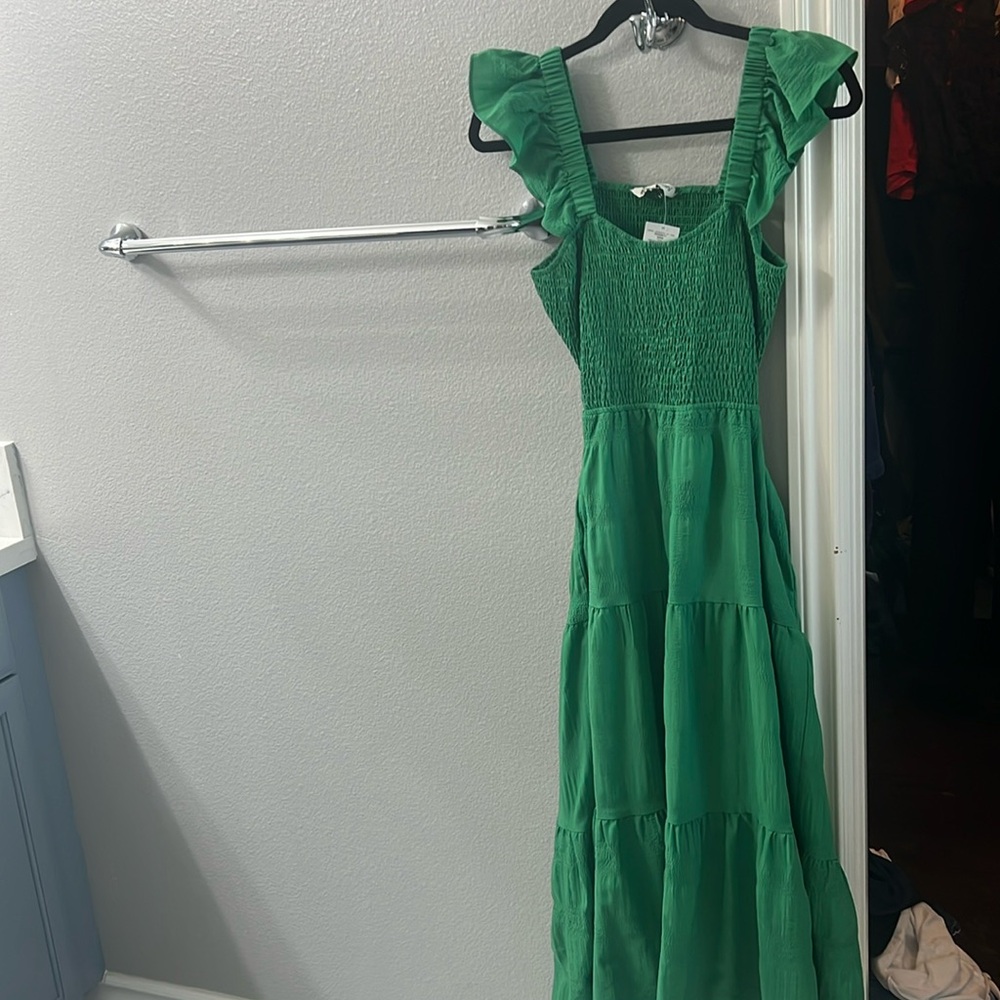 It’s a green midi dress size medium
